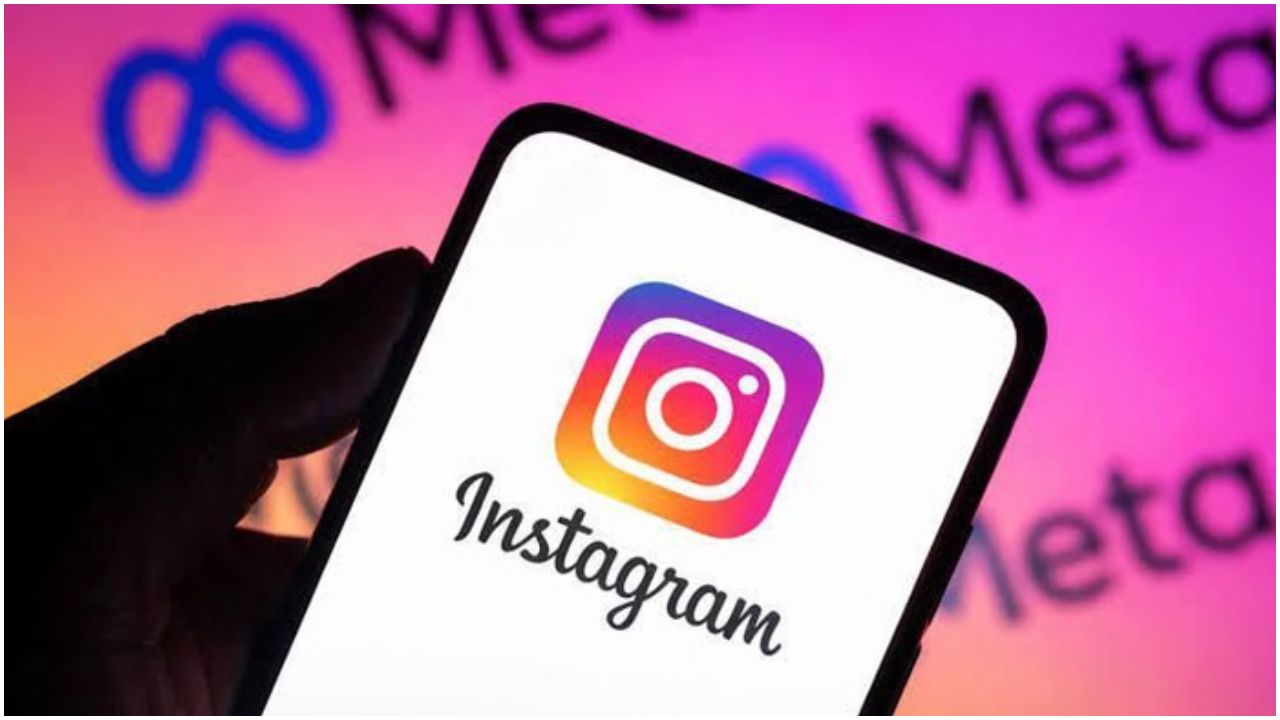 Smartphone displaying the Instagram logo on a gradient pink–orange background