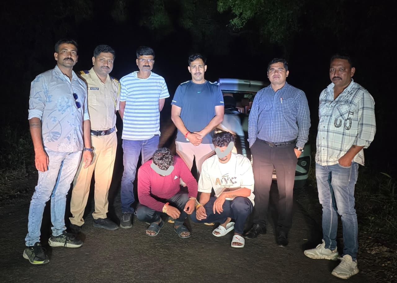IMG-20260909-WA0014 - NewsNation Online Eight men posing on a dark road at night, two kneeling in front, with a car visible in the background.