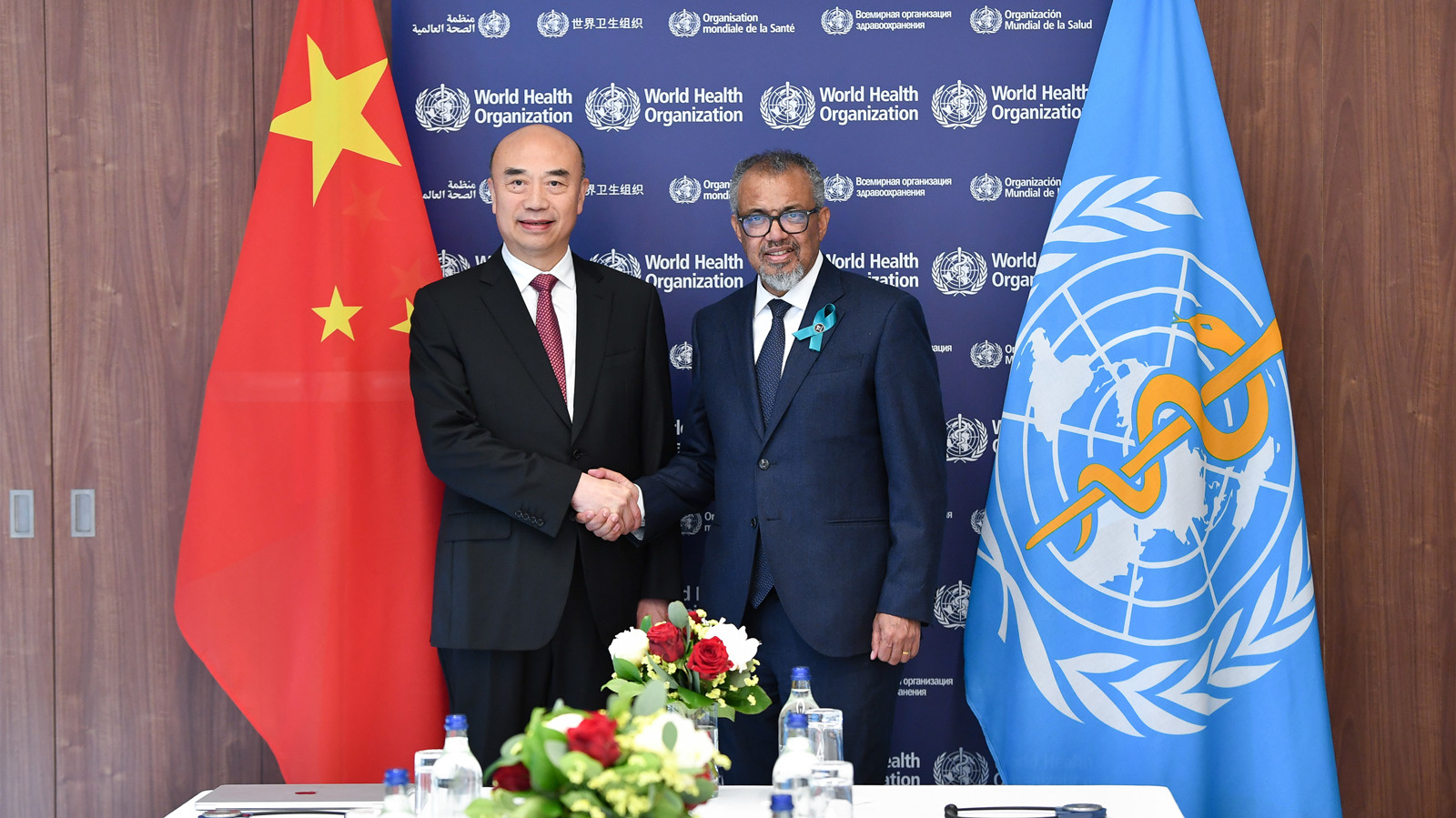 Chinese and WHO officials at the World Health Organization