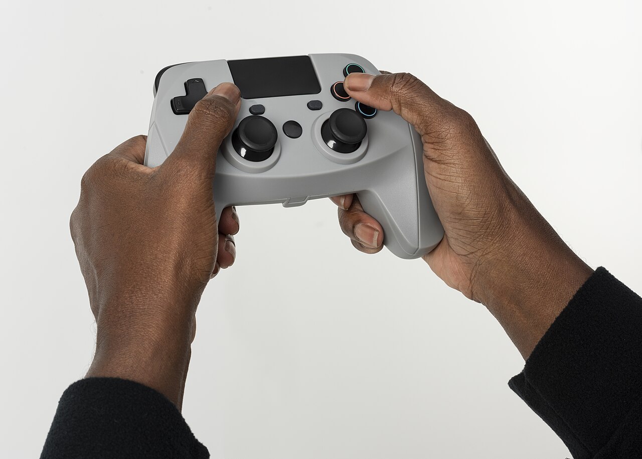 Illustrative archive photograph of hands holding a video game controller; not the Xbox Nano product.