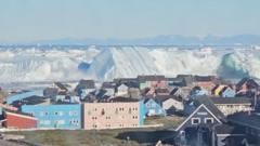 Watch: Giant iceberg turns over near Greenland's coast